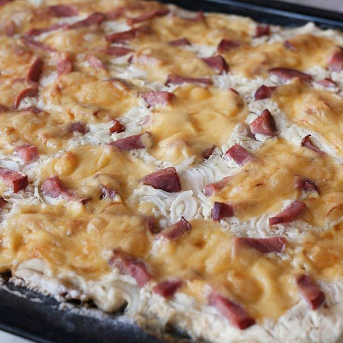 Tarte flambée or Alsace onion tart. Culinary school recipes of of world-famous dishes.