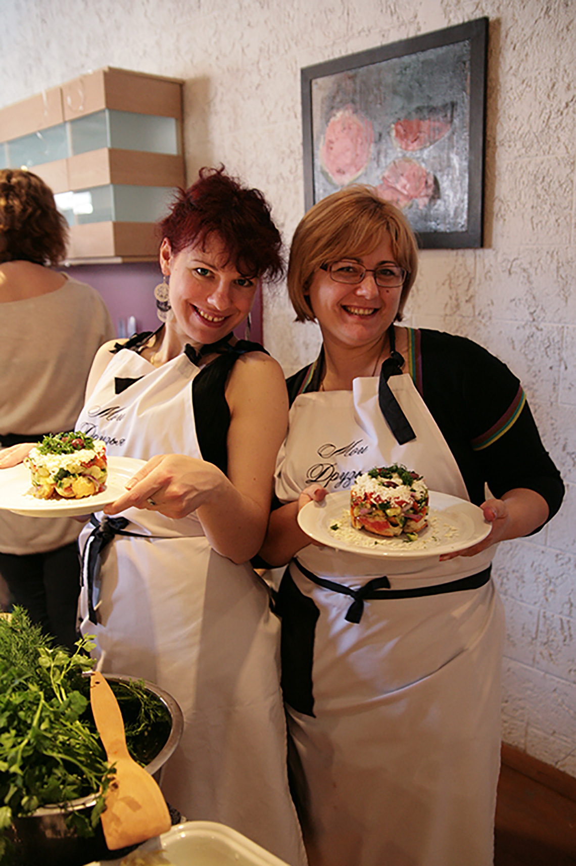 Participants with salad. The birthday of “My Friends” cooking school. Cooking school in Ukraine.