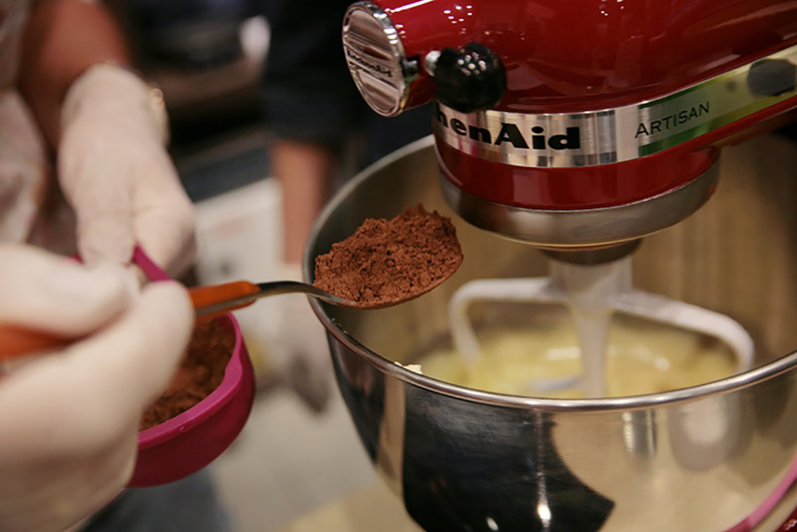Adding of cocoa powder. Lesson Red Velvet Cake. Cooking class at “My Friends” cooking school in Odessa.